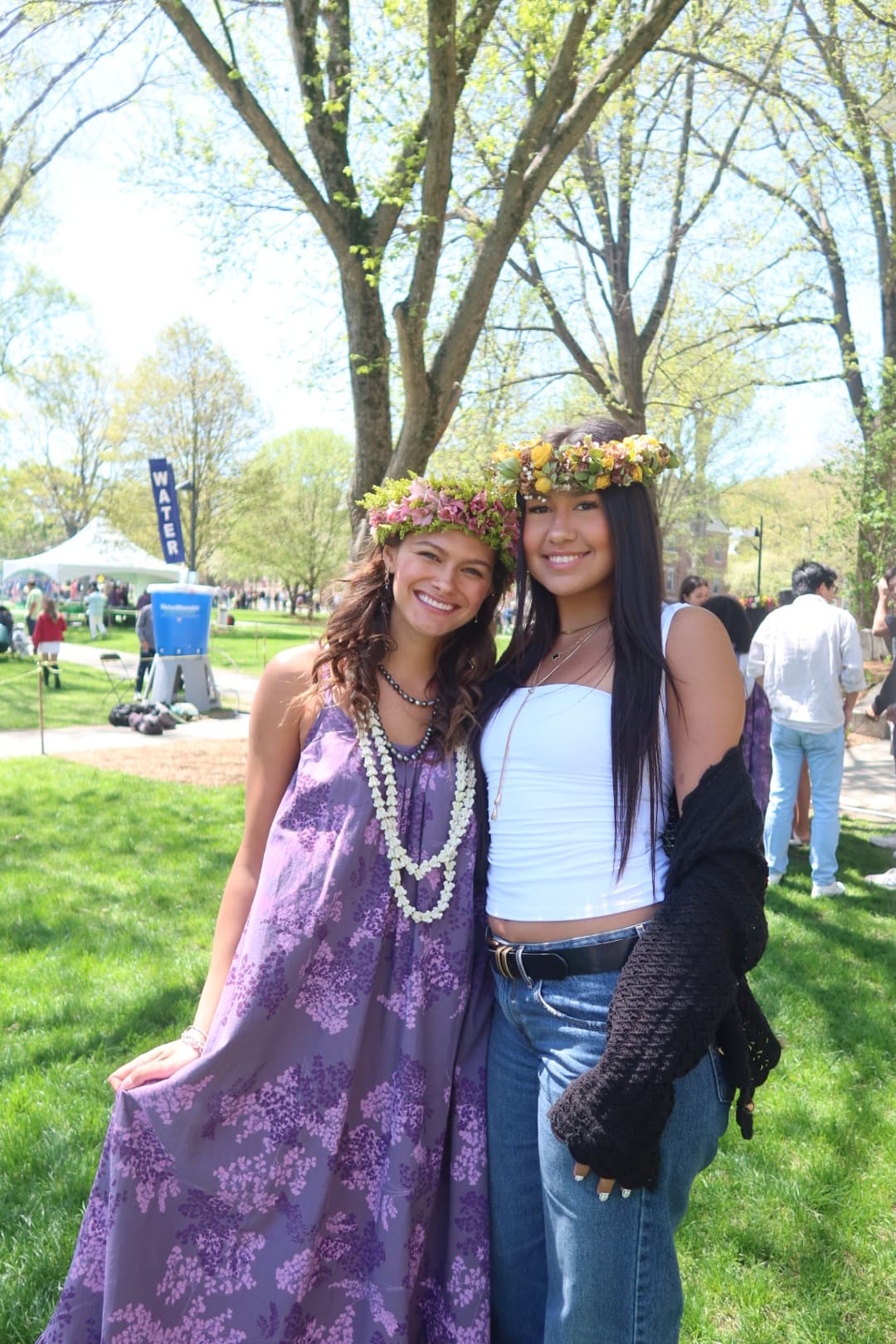 Two sisters wearing flower crowns together on the Green