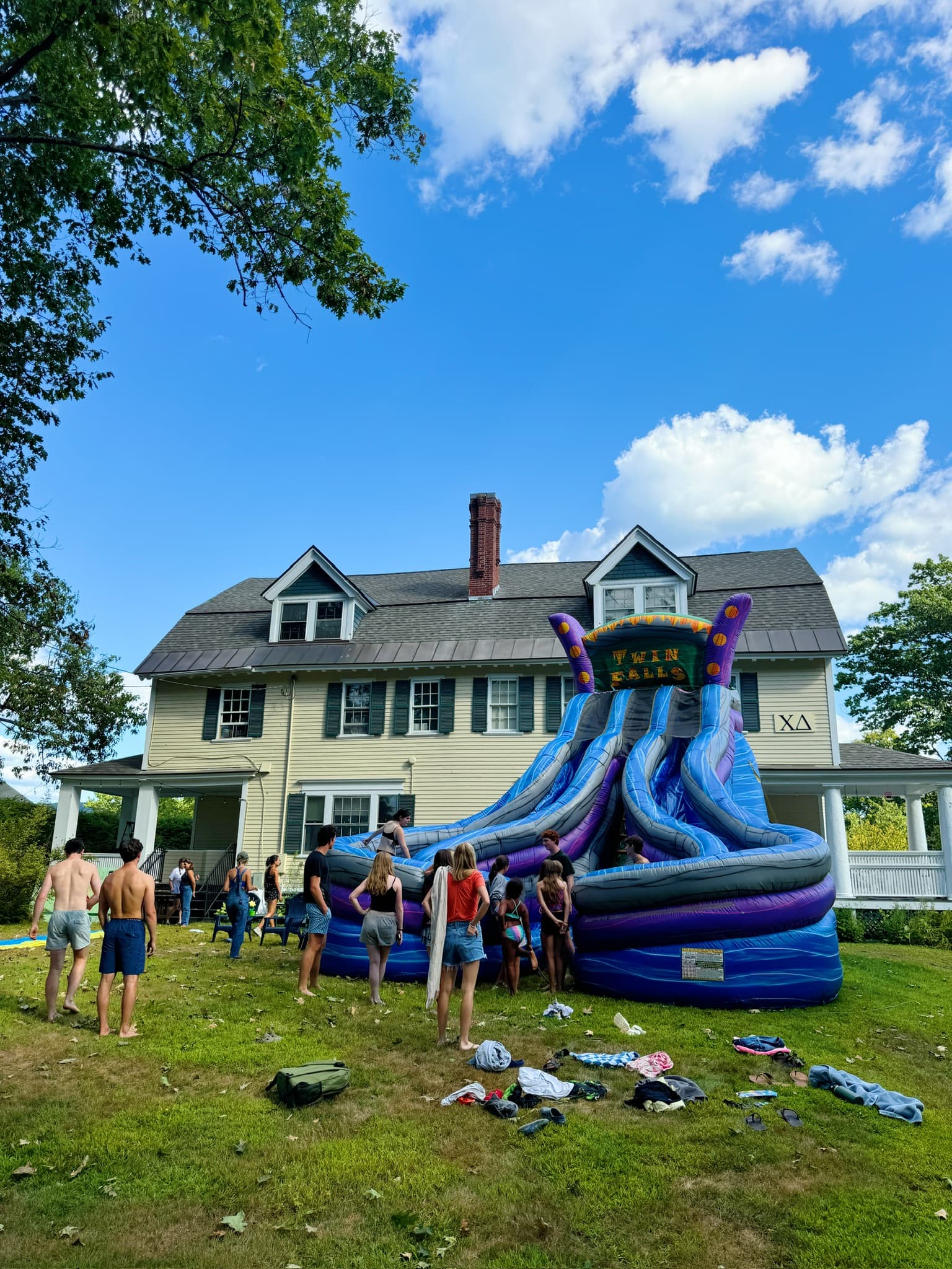 A water slide set up on the haus lawn for a fundraiser