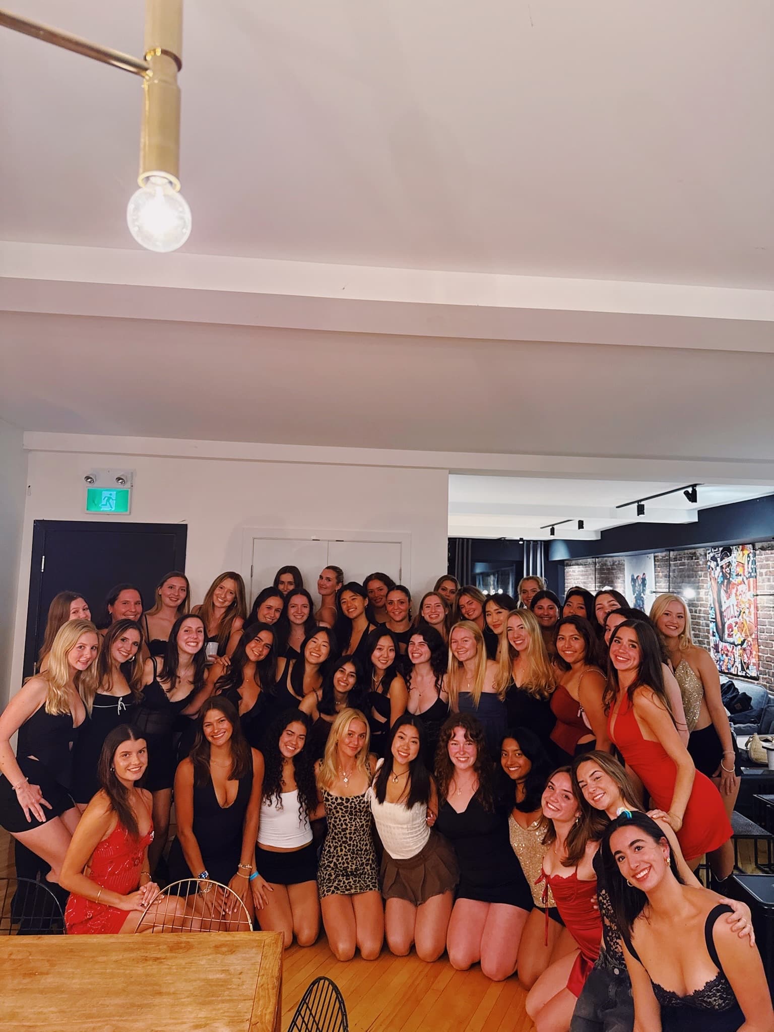 The full chapter gathered for a group photo at a semi-formal event